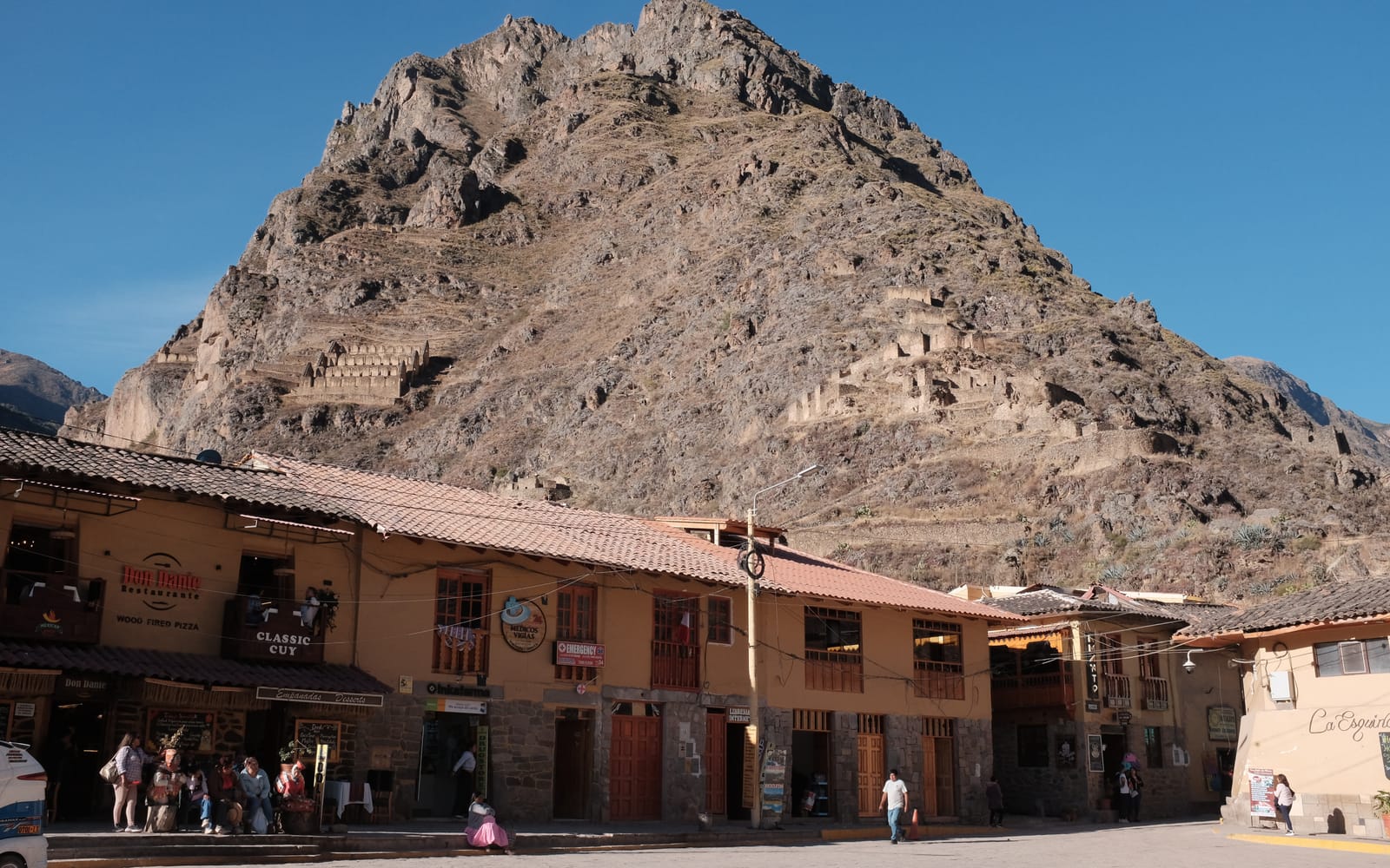 Ollantaytambo town beneath the Pinkuylluna mountain at dusk