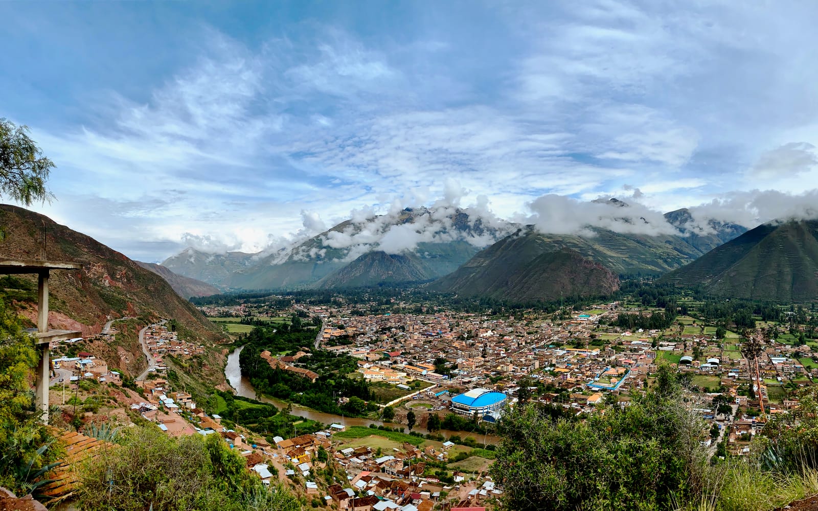 The town of Urubamba spread along the green floor of the Sacred Valley