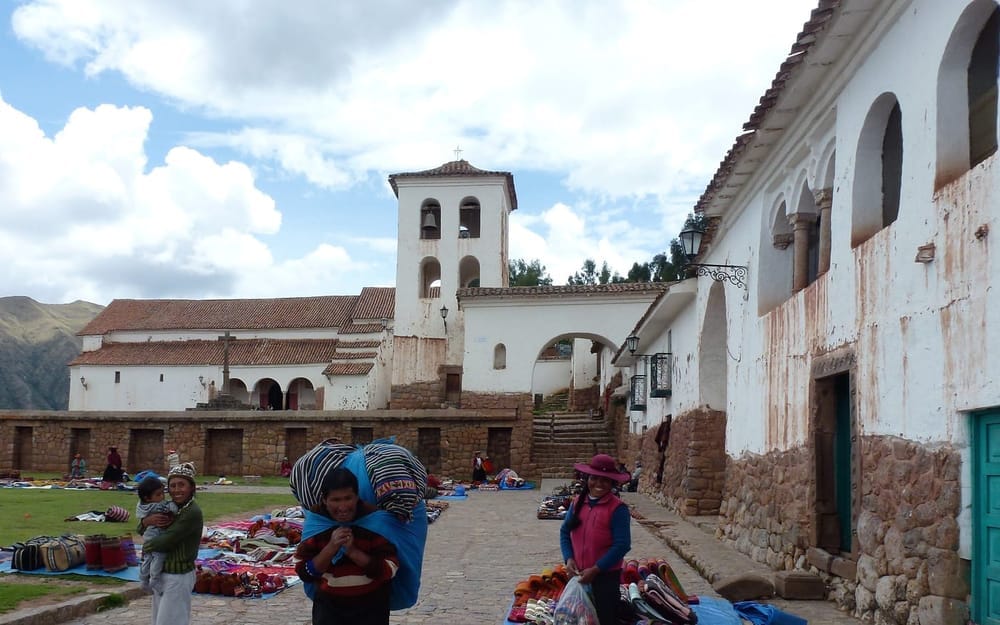 The whitewashed colonial church and market square of Chinchero