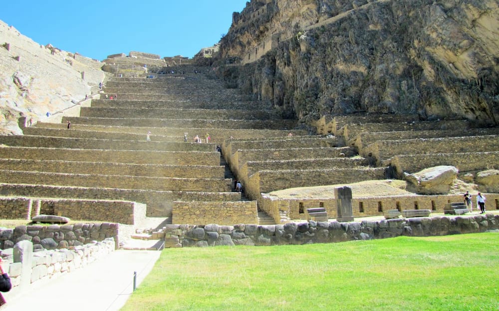 Green Inca terraces climbing the hillside at Ollantaytambo